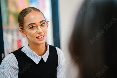 Photos A wonderful Caucasian woman taking a gander at her colleague