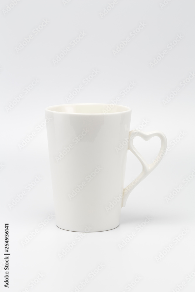 A white creamy cup with heart symbol handle A white creamy cup with heart symbol handle