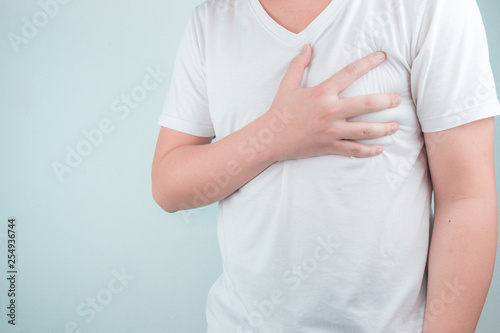 Wallpaper Mural Asian men use hands to hold their hearts. Showing pain from heart disease,Heart attack symptom Healthcare and medical concept Torontodigital.ca