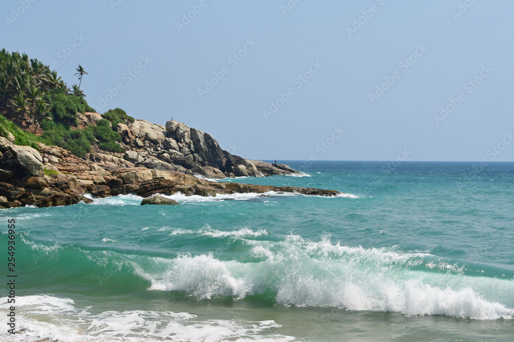 India, Kerala. Beach of the Indian ocean in sunny day