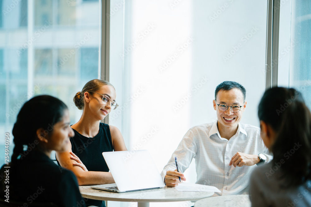 A gathering of experts talking about a venture inside a meeting room. They are getting together to complete a specific occupation in corporate clothing and exquisite dresses. A gathering of experts talking about a venture inside a meeting room. They are getting together to complete a specific occupation in corporate clothing and exquisite dresses.