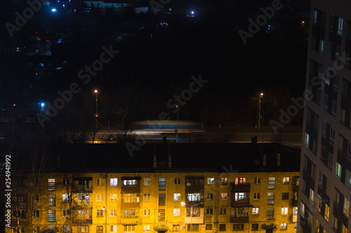Wallpaper Mural Building with people silhouettes in windows. Casual urban city life. Traffic on the road. People waite bus on busstop with traffic light. Aerial panoramic view from tower rooftop Torontodigital.ca
