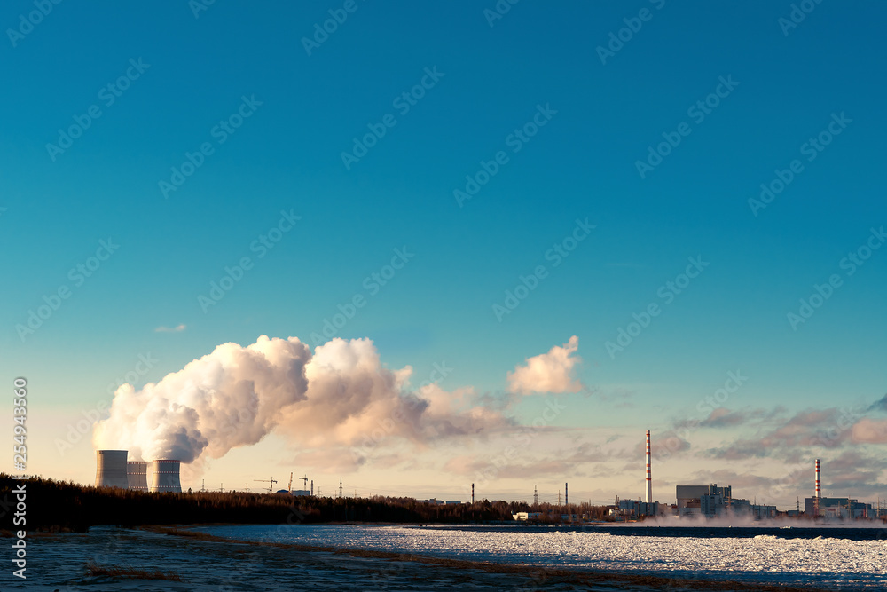 cooling towers emit steam at a nuclear power plant located on the shore of the Bay.Cooling of nuclear reactor