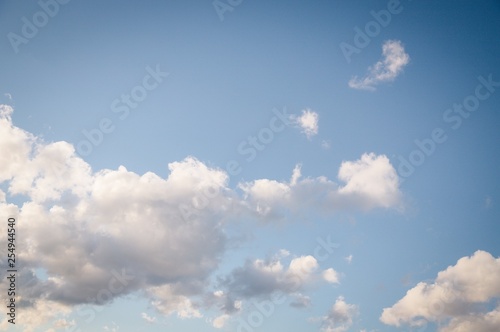 Beautiful white soft fluffy clouds on a blue sky background