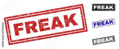 Grunge FREAK rectangle stamp seals isolated on a white background. Rectangular seals with grunge texture in red, blue, black and gray colors.