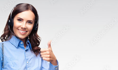 Support phone operator with thumb up gesture, on grey