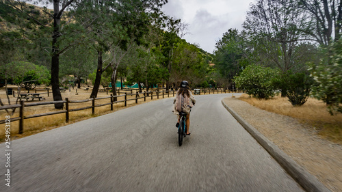 girl rides electric bicycle on Catalina island