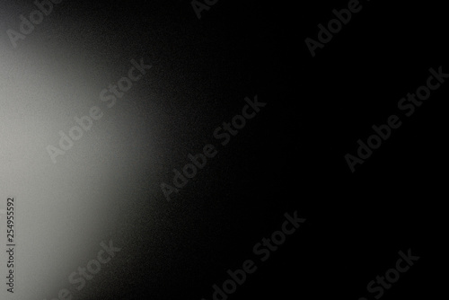 Background in a black, soft color illuminated with a delicate light.