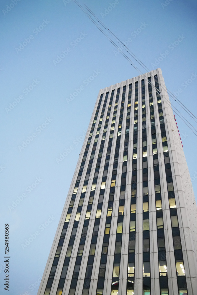 one skyscraper bottom view. business center on the background of a clear sky. gray residential complex one skyscraper bottom view. business center on the background of a clear sky. gray residential complex