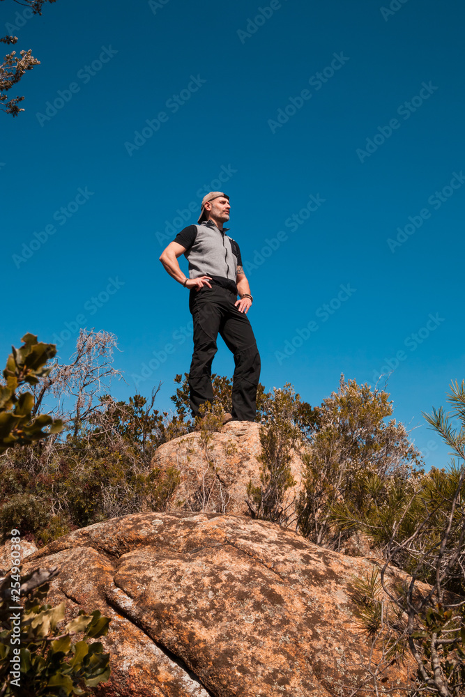 Hiker standing on a rock in the nature