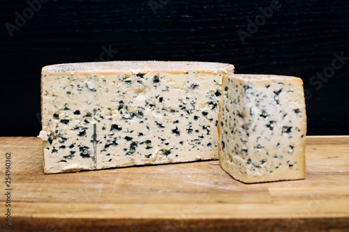 Mild blue Auvergne cheese Fourme d' Ambert from France photo