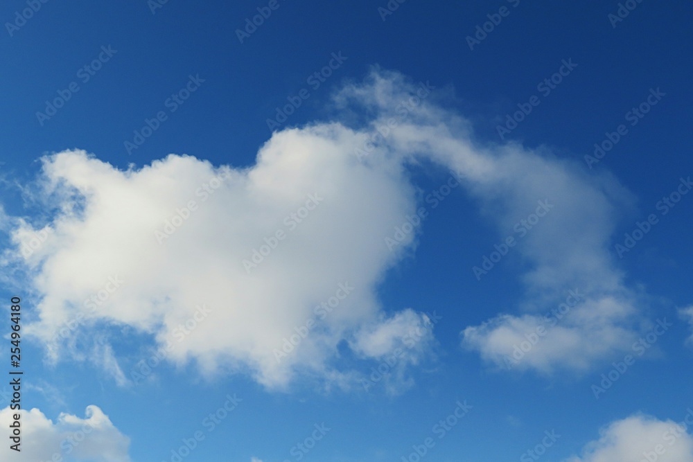 Heart shape cloud in blue sky background, natural cloudscape Heart shape cloud in blue sky background, natural cloudscape