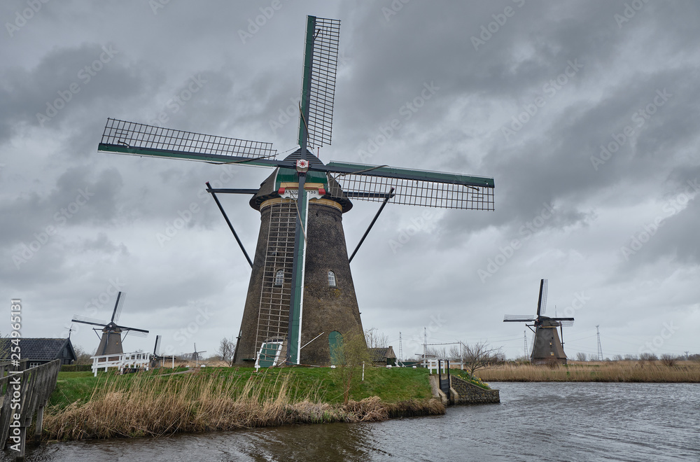 Windmills in a cloudy and windy day - South holland - Group of 19 monumental windmills - Molens of Kinderdijk.