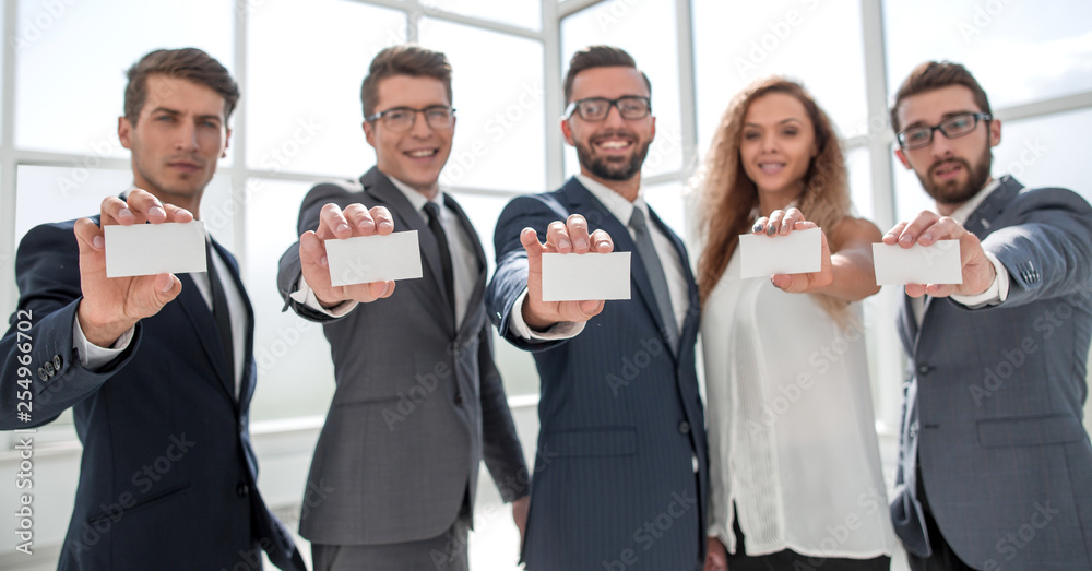 professional business team showing their business cards professional business team showing their business cards