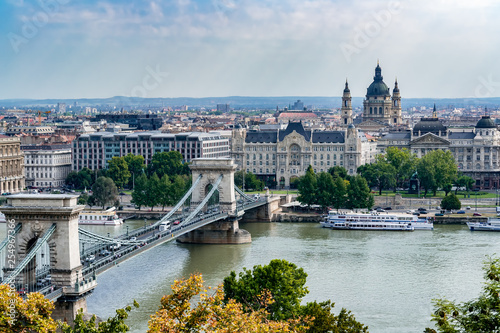 Aerial view of Szechenyi Chain Bridge with Academy of Science and St. Stephen's Basilica in background - Budapest, Hungary © UlyssePixel
