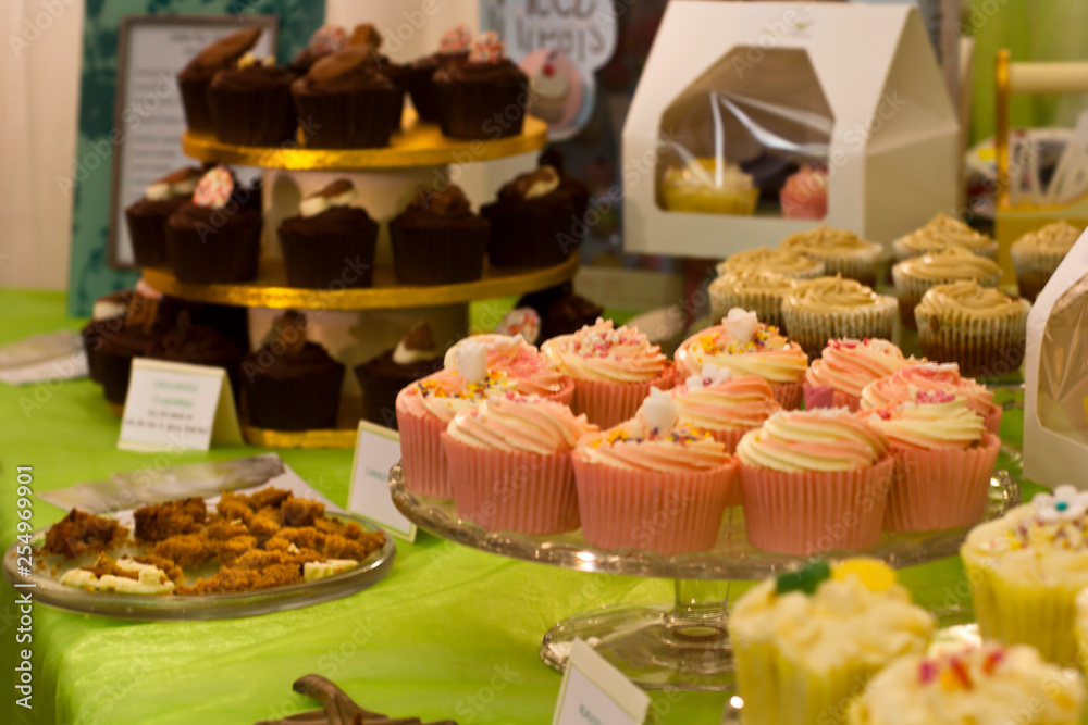 fresh cupcakes and cakes on street food market
