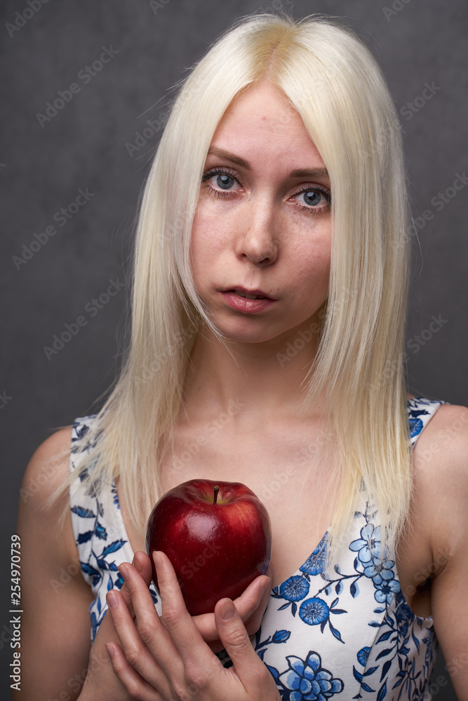 beautiful girl in a fashionable dress with apple beautiful girl in a fashionable dress with apple
