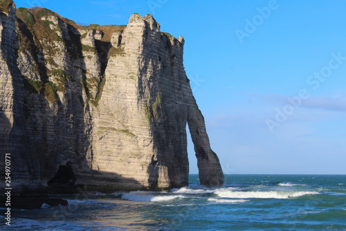 Picturesque panoramic landscape on the cliffs of Etretat. Natural amazing cliffs. Etretat, Normandy, France, La Manche or English Channel. Coast of the Pays de Caux area in sunny summer day 