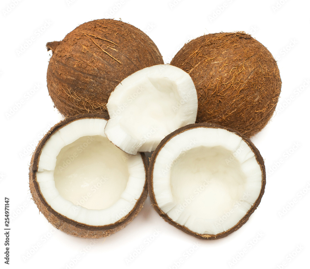 Coconuts whole, half and piece isolated on white background. Tropical fruit. Flat lay, top view Coconuts whole, half and piece isolated on white background. Tropical fruit. Flat lay, top view