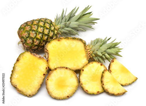 Pineapple whole and rings isolated on white background. Creative tropical fruit concept. Flat lay, top view