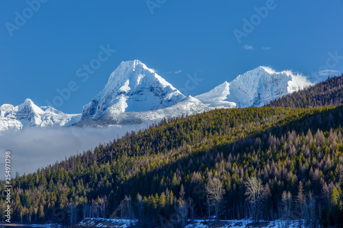 Fototapeta Naklejka Na Ścianę i Meble -  Snow covered mountain peaks Glacier National Park, Montana