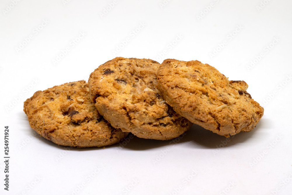 Cookies bakery photo closeup on white background. Bakery studio photo. Dry cookie with raisin closeup Cookies bakery photo closeup on white background. Bakery studio photo. Dry cookie with raisin closeup