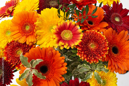 A large bouquet of bright orange flowers  gerberas 