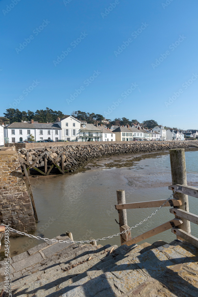 Instow, North Devon, England, UK. March 2019. Instow viewed from the harbour steps over the River Kerridge estuary.