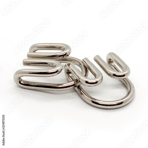 Cast Metal Brain Teaser Puzzle. Devil. Dragon claws Devil's claws. isolated on white background