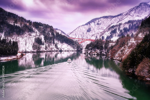 Beautiful landscape from Shogawa Gorge Cruise. A cruise ship on the Shogawa. Toyama is located in Japan. Feb 2, 2019. photo