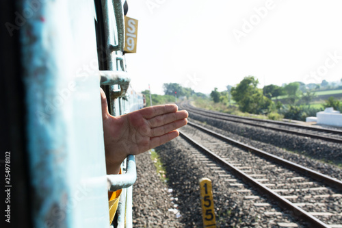 Indian Boy taking hand Outside the Train Window