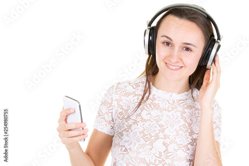young glad woman listening to music on cellphone