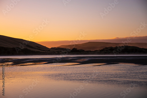 Sunset on Slope Point, south coast, New Zealand 1 © Bigrain.stock