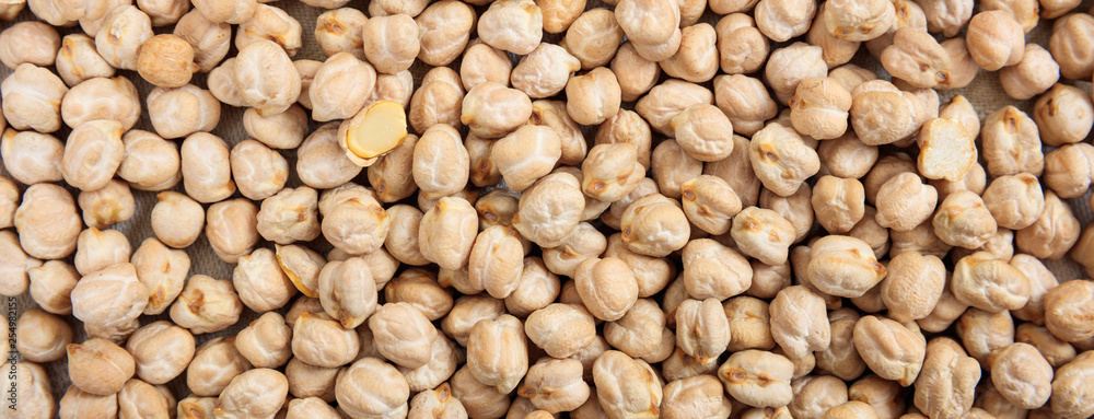 Dry chickpeas uncooked full background, banner, top view