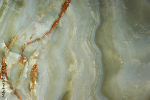 Green onyx with veins, the surface of natural stone