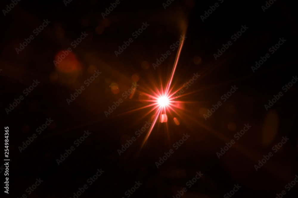 abstract lens flare red light over black background abstract lens flare red light over black background