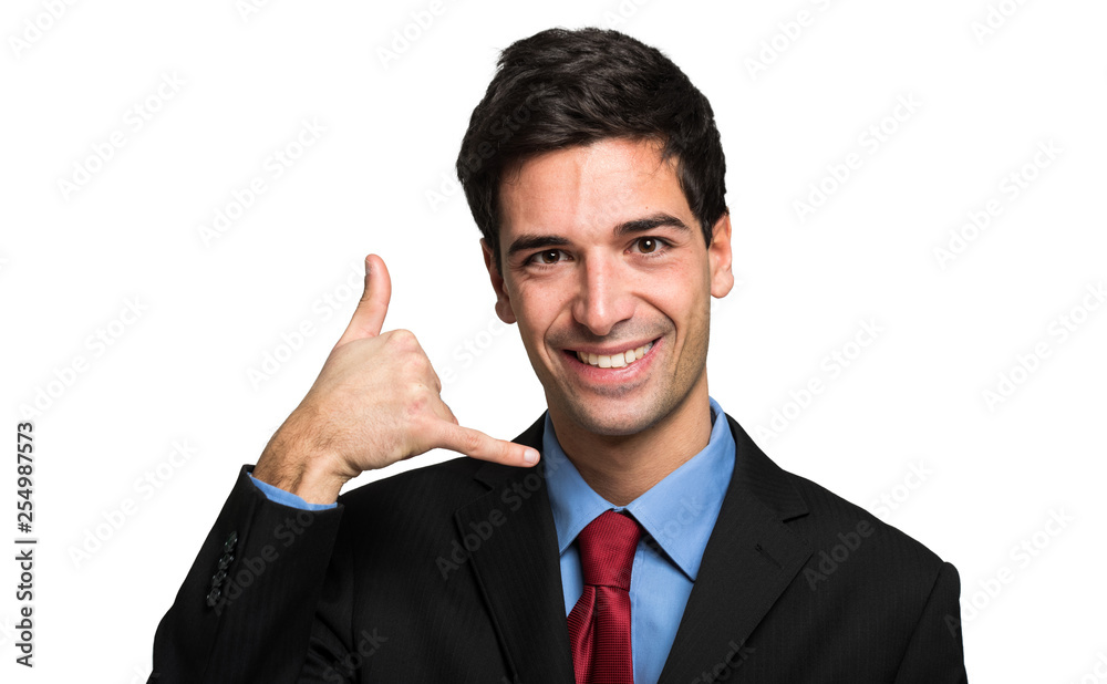 Handsome businessman shwoing call me gesture isolated over white background Handsome businessman shwoing call me gesture isolated over white background