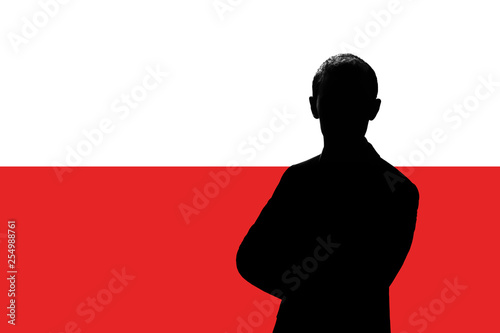 Silhouette of businessman on the background of the Polish flag.