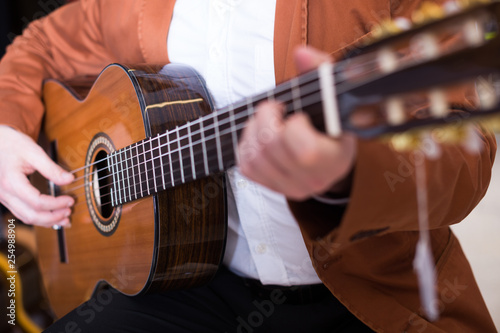Male musician performing on guitar