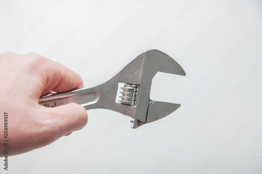 hand holding wrench hand holding wrench