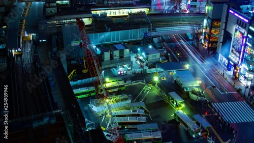 Night time lapse near the crossing at the station in Shibuya Tokyo photo