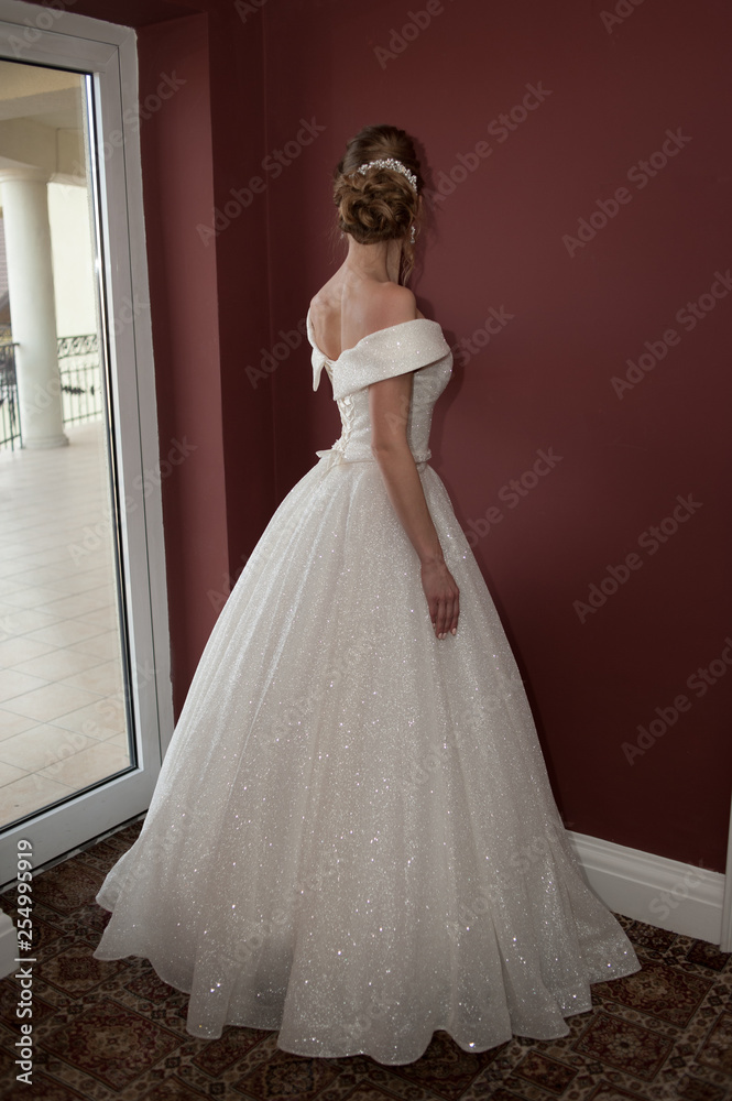 Portrait of a beautiful bride woman in elegant white wedding dress. Luxurious apartments. Portrait of a beautiful bride woman in elegant white wedding dress. Luxurious apartments.