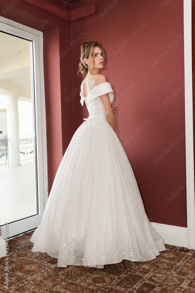 Portrait of a beautiful bride woman in elegant white wedding dress. Luxurious apartments. Portrait of a beautiful bride woman in elegant white wedding dress. Luxurious apartments.