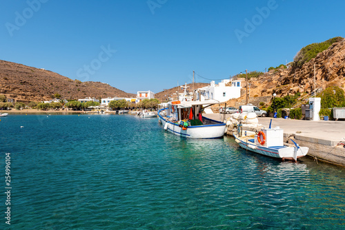 The picturesque seaside village of Faros with fishing boats moored in the port. Sifnos, Greece © vivoo