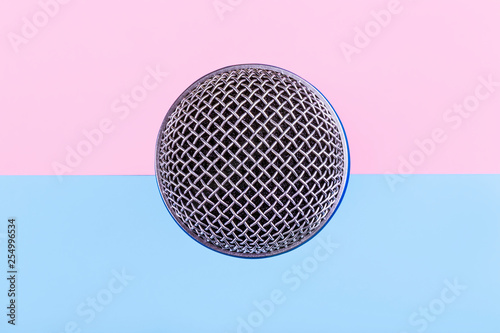 top view of the microphone on a pink blue background, singing accessory © alesmunt
