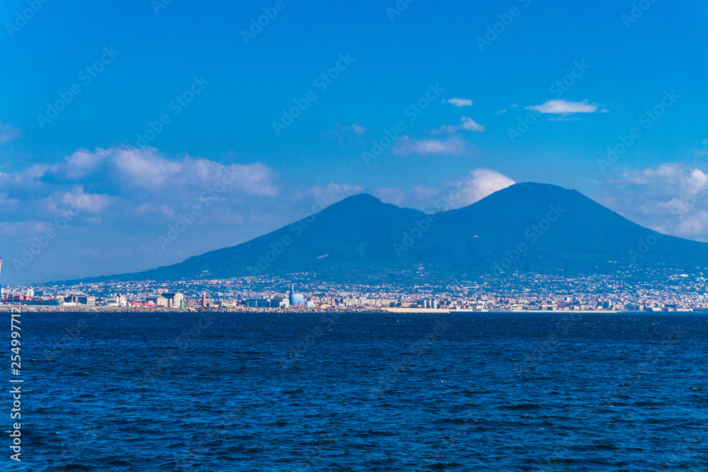 View of the coast of Naples with the Vesuvio from the blue mediterranean sea.