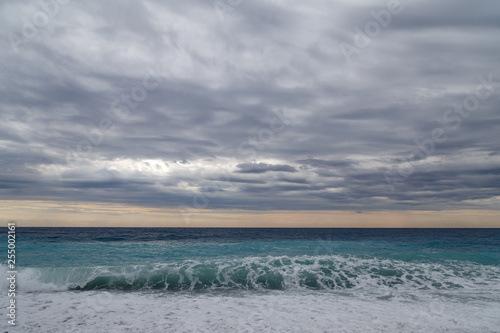 View of the sea and cloudy sky. Cloudy day on the beach. Seascape, Mediterranean.