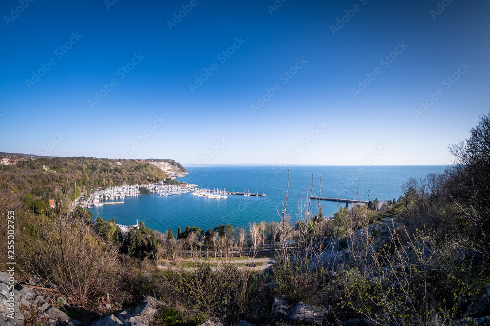 Panoramic view to bay of Sistiana with harbor and beach