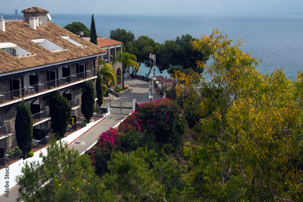 Beautiful villa against the backdrop of the Mediterranean is immersed in spring flowers. Malaga, Spain, Andolusia.