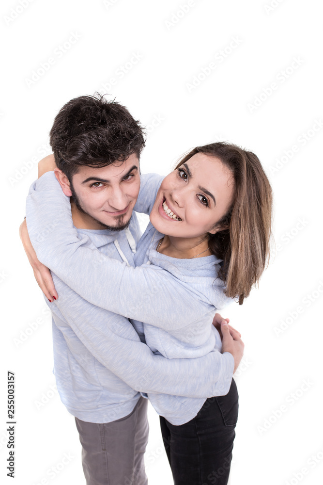 Couple in blue hugging isolated on white Couple in blue hugging isolated on white